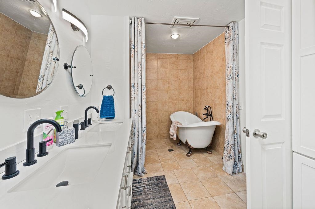 181 Elm Avenue Grand Junction, CO 81501 - Photo 13 of 25 a bathroom with a sink toilet and shower