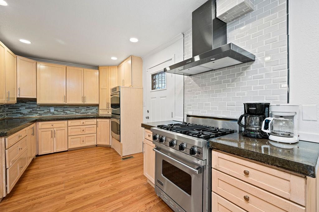 181 Elm Avenue Grand Junction, CO 81501 - Photo 14 of 25 a kitchen with granite countertop cabinets and steel stainless steel appliances