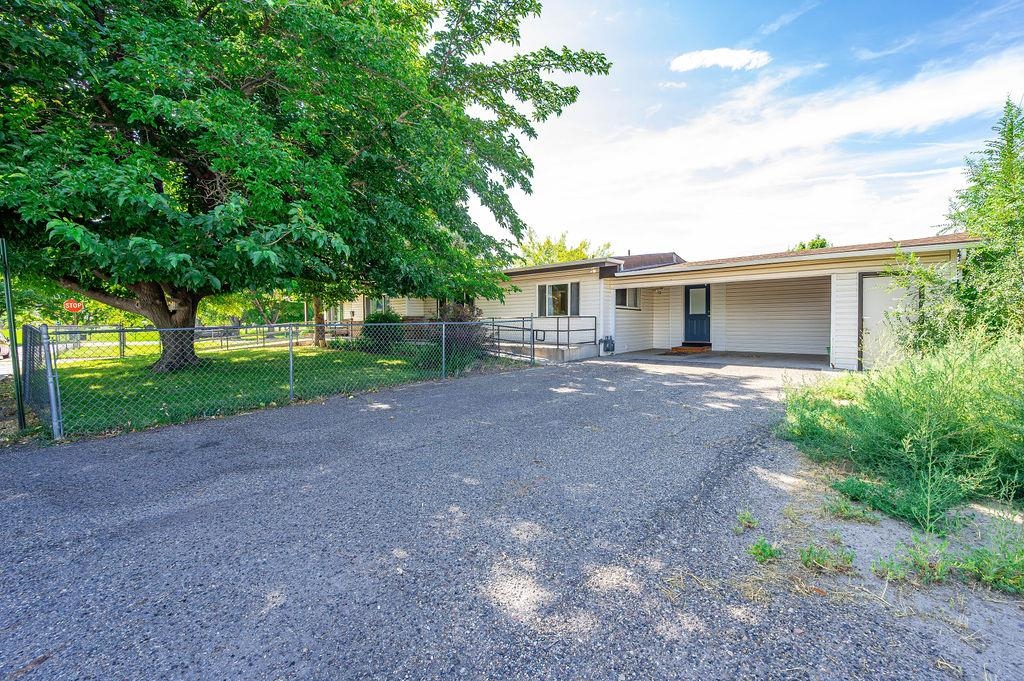 181 Elm Avenue Grand Junction, CO 81501 - Photo 3 of 25 a front view of house with yard and green space