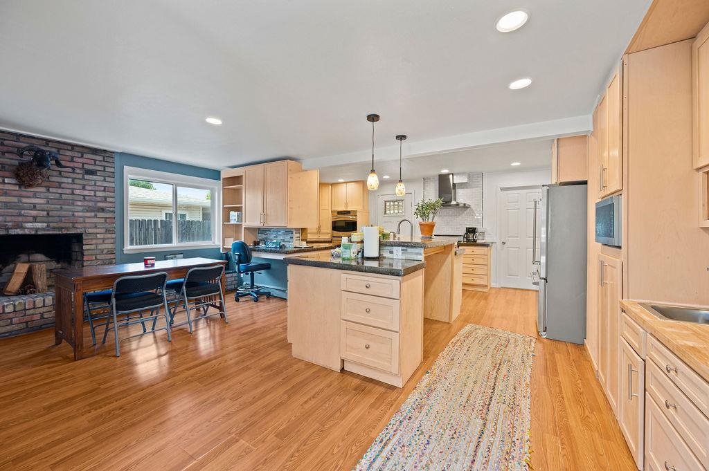 181 Elm Avenue Grand Junction, CO 81501 - Photo 7 of 25 a kitchen with white cabinets and stainless steel appliances