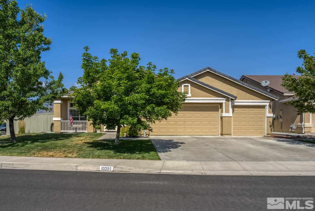 10395 Canyon Country Road Reno, NV 89521 - Photo 1 of 31 a front view of a house with a yard and garage