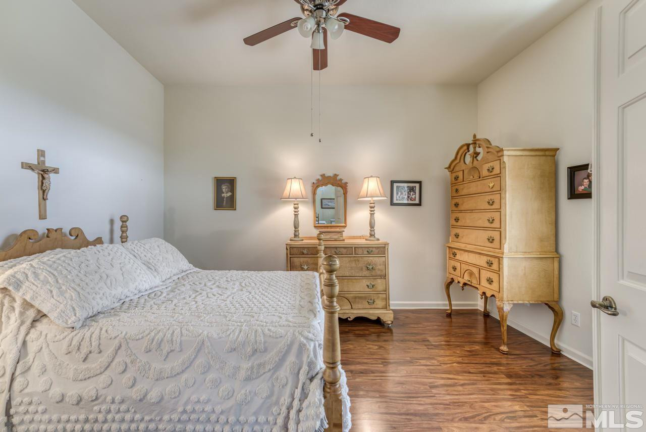 10395 Canyon Country Road Reno, NV 89521 - Photo 24 of 31 a bedroom with a bed and a table