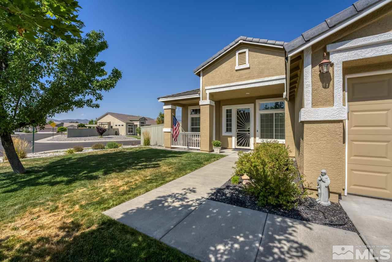 10395 Canyon Country Road Reno, NV 89521 - Photo 4 of 31 a front view of a house with garden