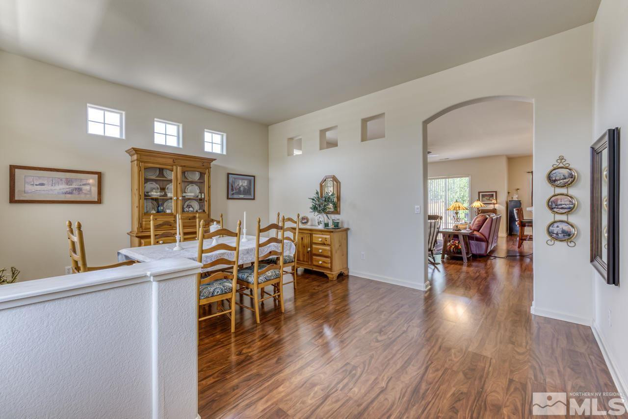 10395 Canyon Country Road Reno, NV 89521 - Photo 6 of 31 a living room with furniture and wooden floor