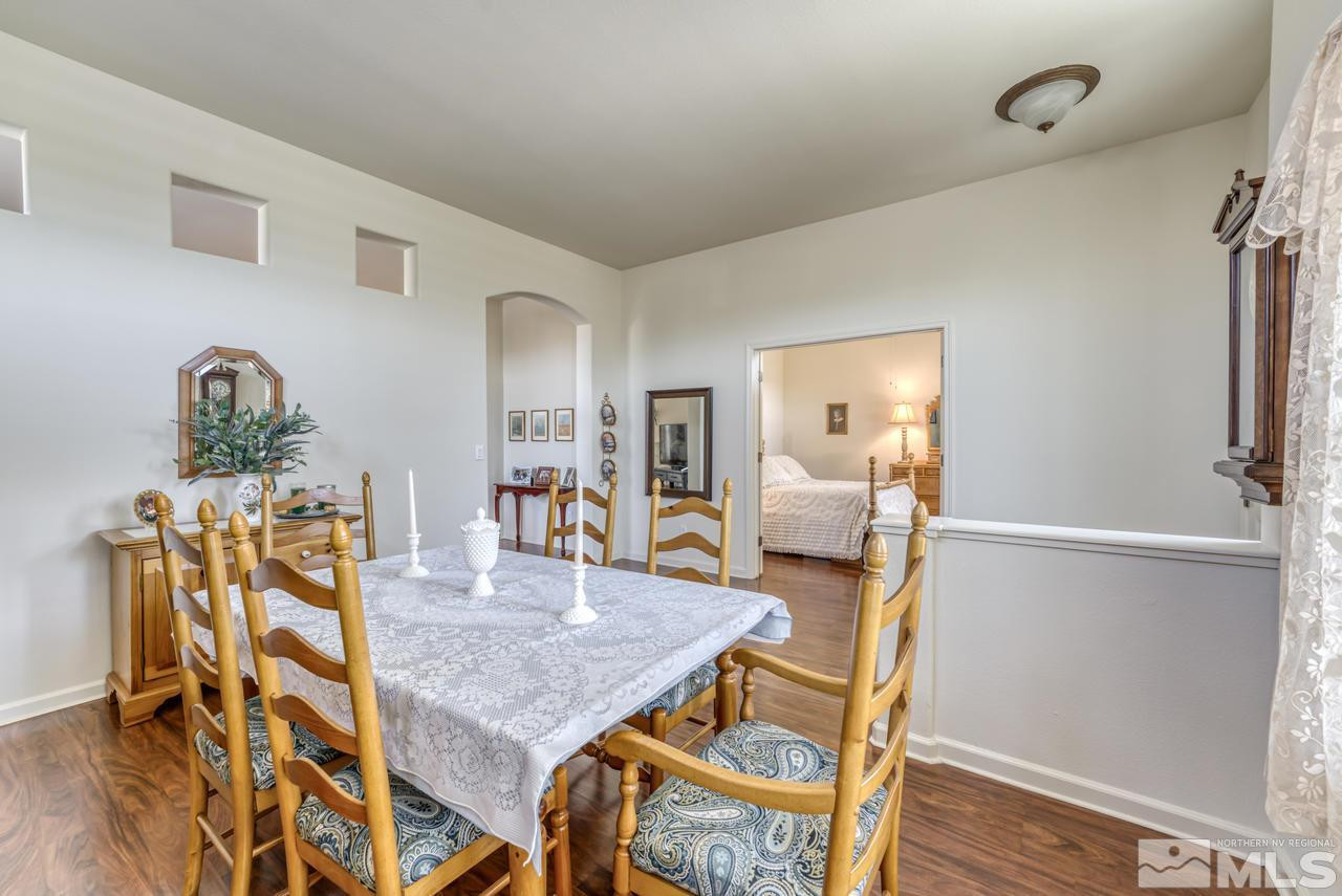 10395 Canyon Country Road Reno, NV 89521 - Photo 7 of 31 a dining room with furniture and wooden floor