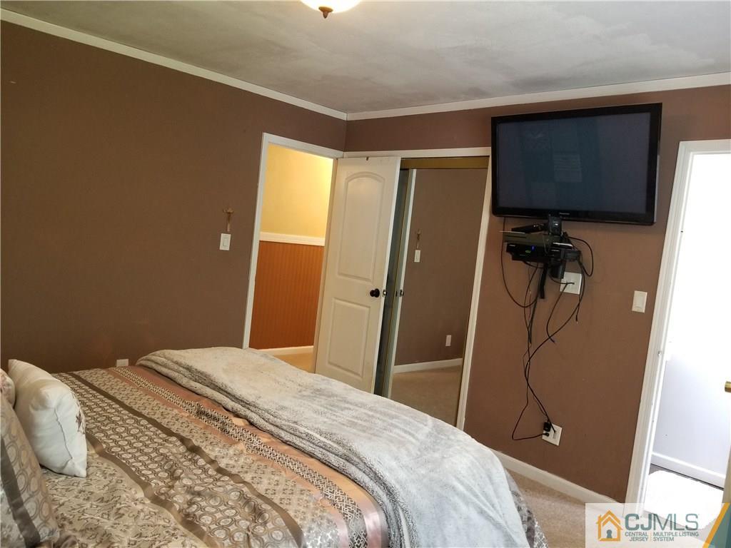 162 Princeton Road Old Bridge, NJ 08859 - Photo 14 of 23 a bedroom with a bed and cabinets