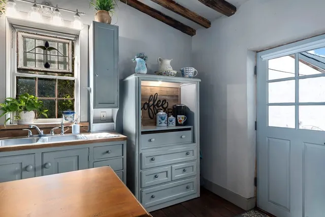 a kitchen with a sink and cabinets