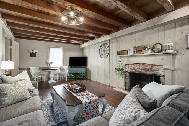 a living room with furniture and a fireplace