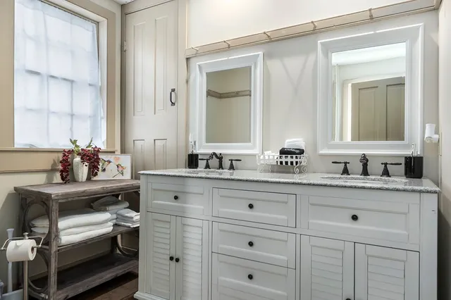 a view of bathroom with dual sinks