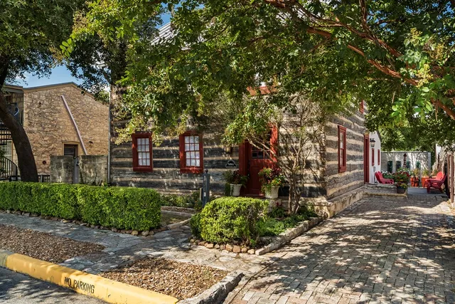 a view of a street with a tree
