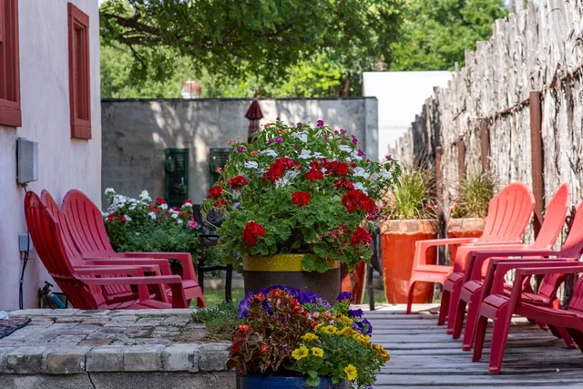 a wooden bench sitting in front of a house