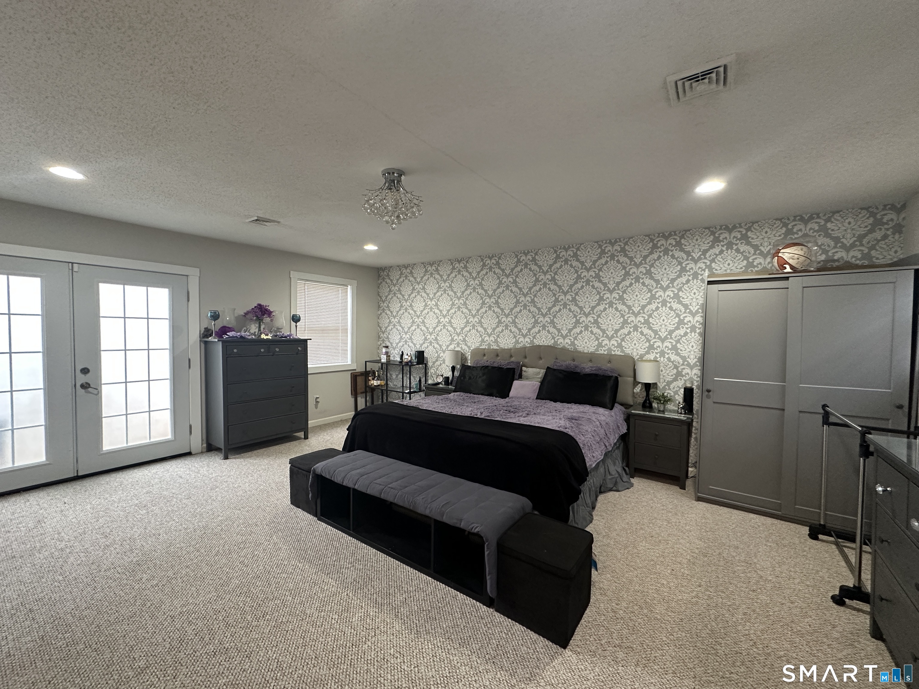 30 King Street Wallingford, CT 06492 - Photo 11 of 23 a spacious bedroom with a bed and furniture