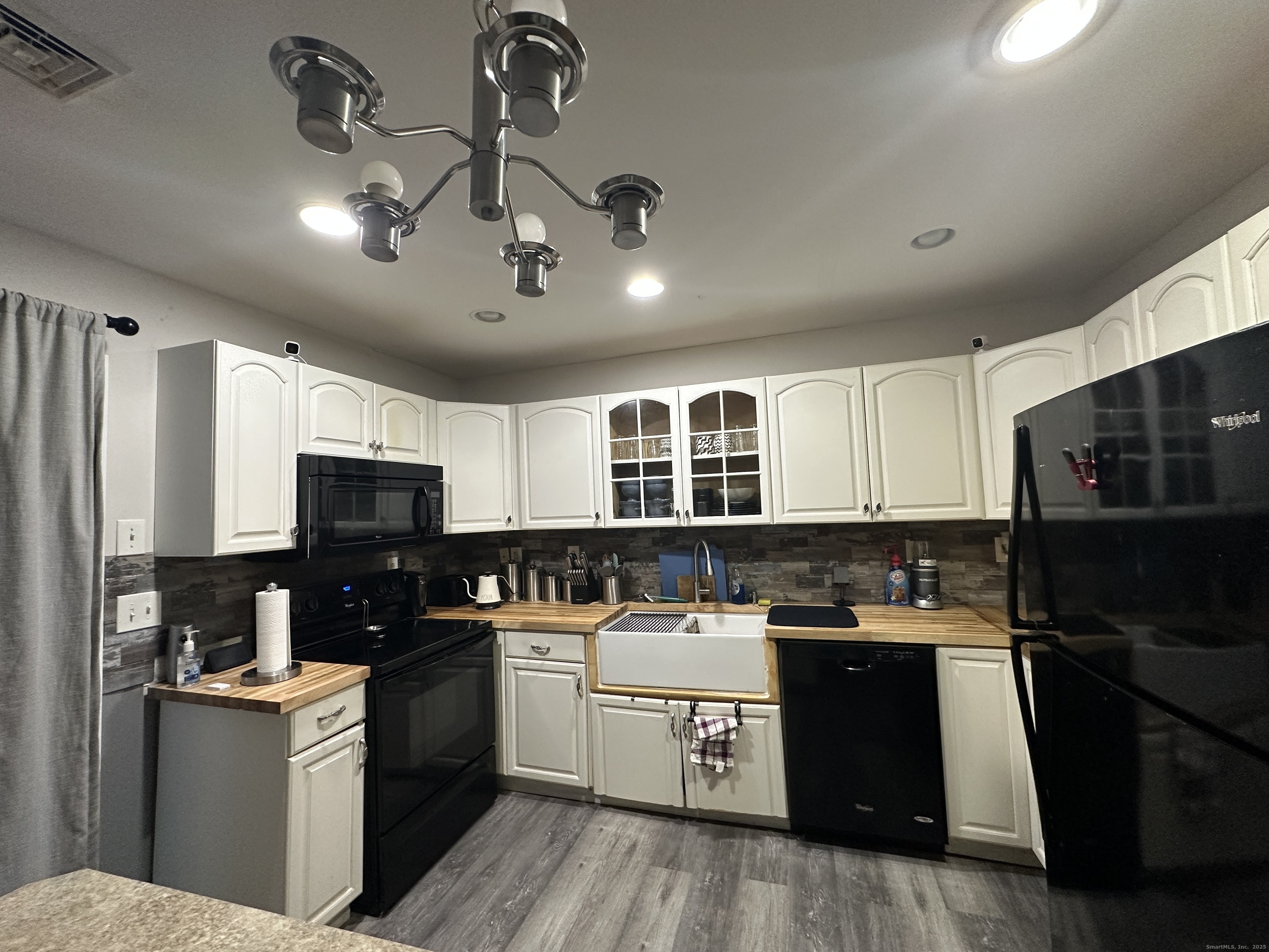 30 King Street Wallingford, CT 06492 - Photo 3 of 23 a kitchen with a sink a counter space appliances and cabinets