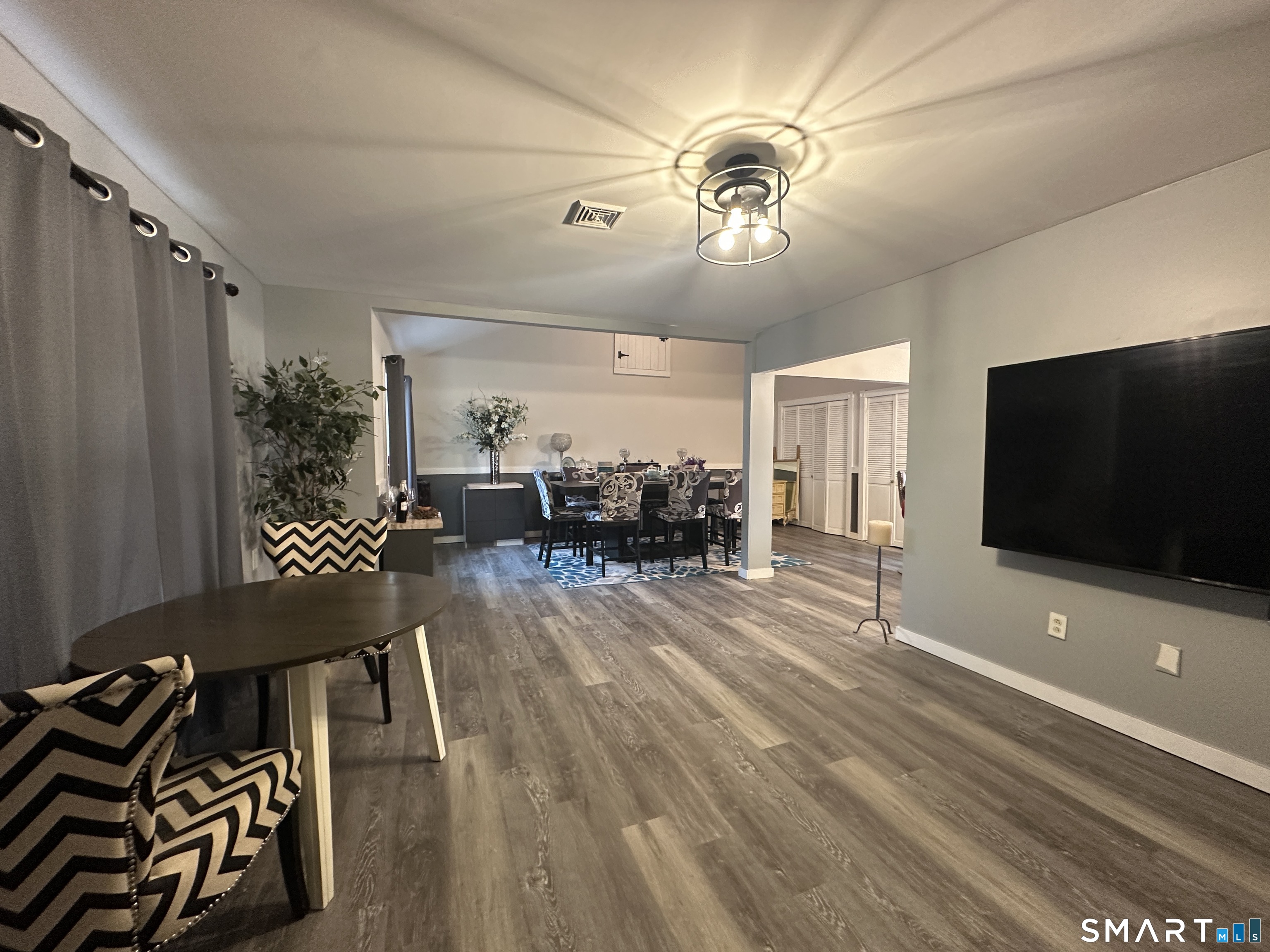 30 King Street Wallingford, CT 06492 - Photo 6 of 23 a view of a livingroom with furniture and a flat screen tv
