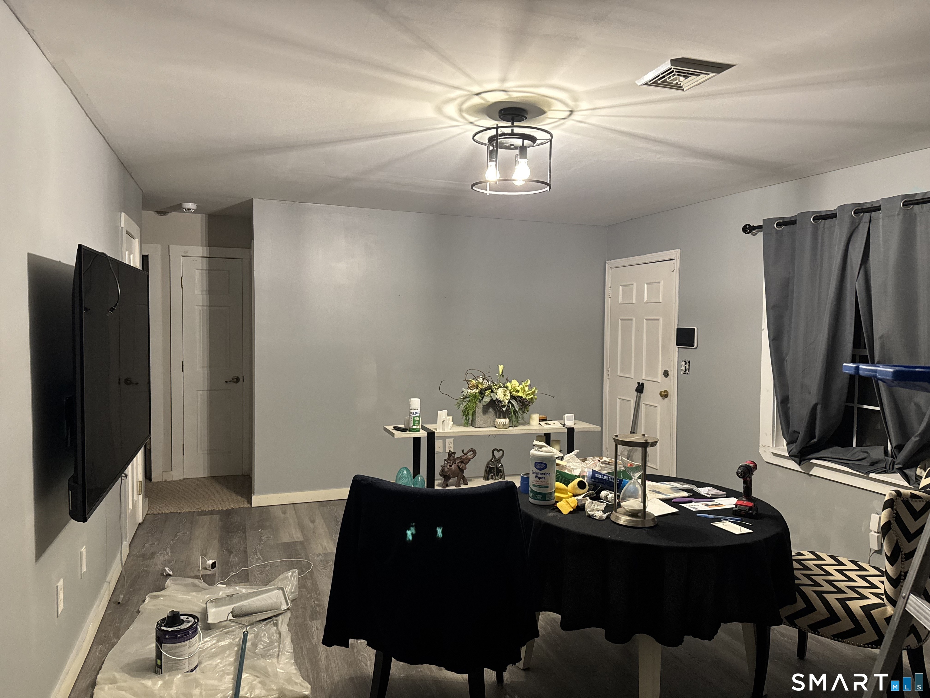 30 King Street Wallingford, CT 06492 - Photo 8 of 23 a living room with furniture and a flat screen tv