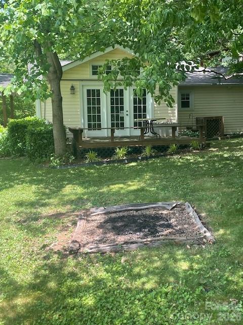 271 Wiggins Road Candler, NC 28715 - Photo 15 of 19 a view of a house with a backyard