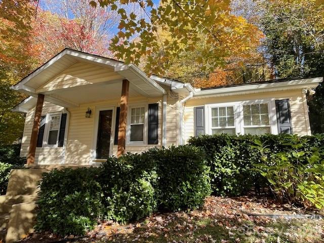 271 Wiggins Road Candler, NC 28715 - Photo 7 of 19 a front view of a house with a yard