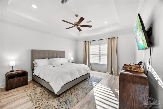 a view of a hallway with closet and wooden floor