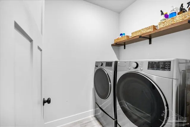 a bedroom with a bed and a chair