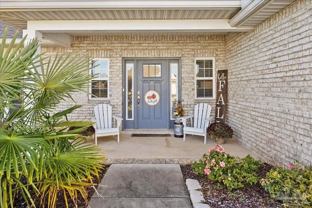 a view of a house with a yard and garage