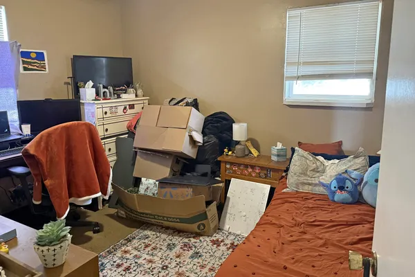 a room with furniture and a window