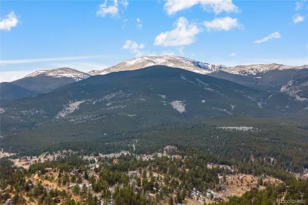 a view of a water with a mountain in the background