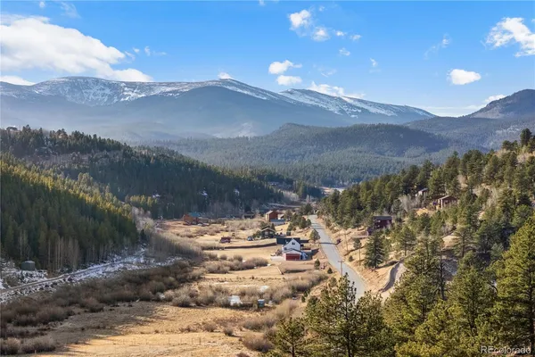 a view of a city with lots of trees