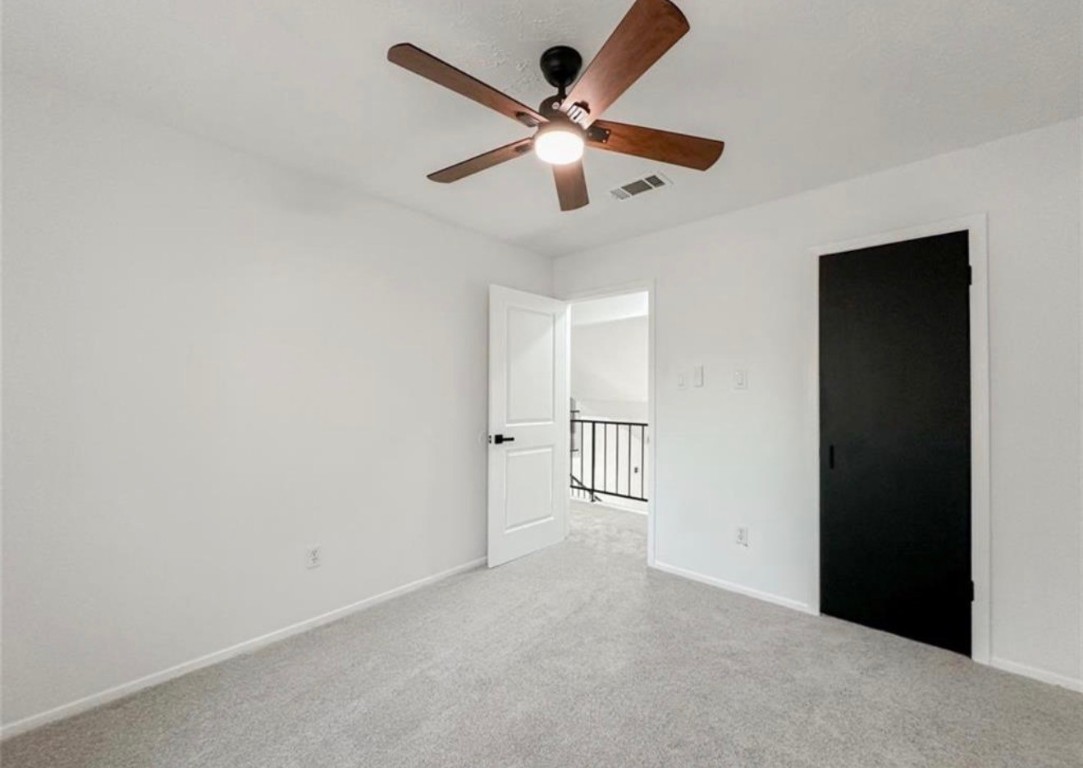 7311 Fuchsia Lane Humble, TX 77346 - Photo 21 of 38 an empty room with white walls and ceiling fan