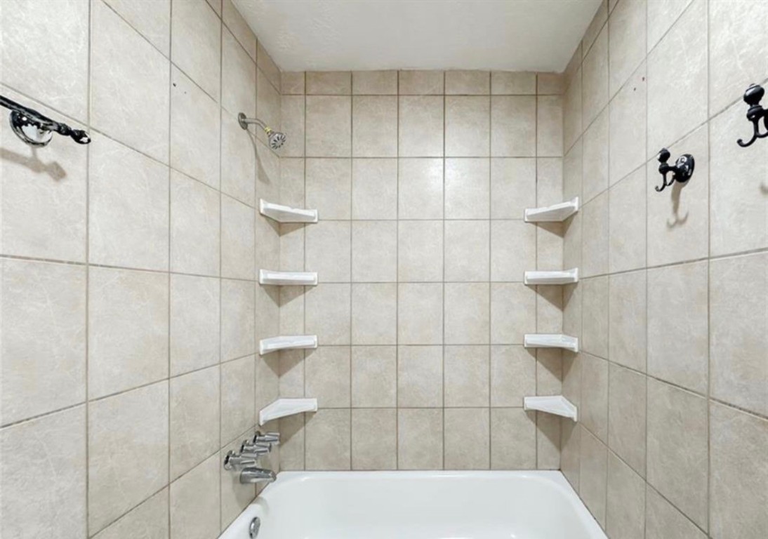 7311 Fuchsia Lane Humble, TX 77346 - Photo 27 of 38 a bathroom with a shower