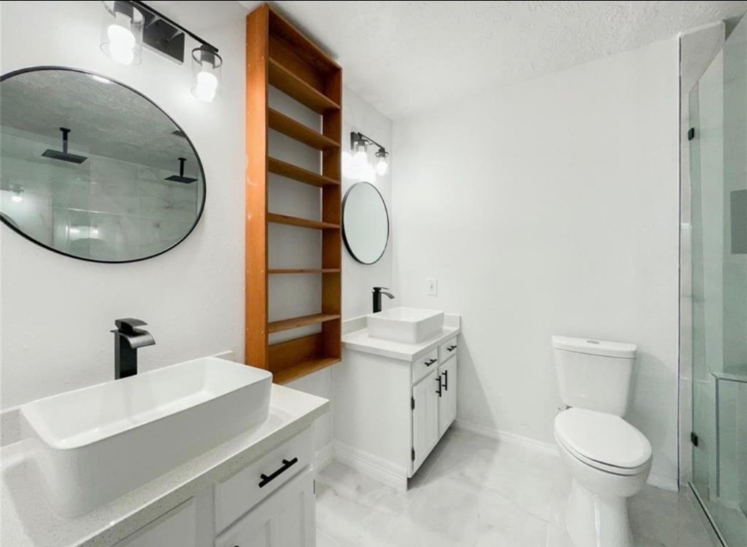 7311 Fuchsia Lane Humble, TX 77346 - Photo 33 of 38 a bathroom with a sink a toilet and a mirror