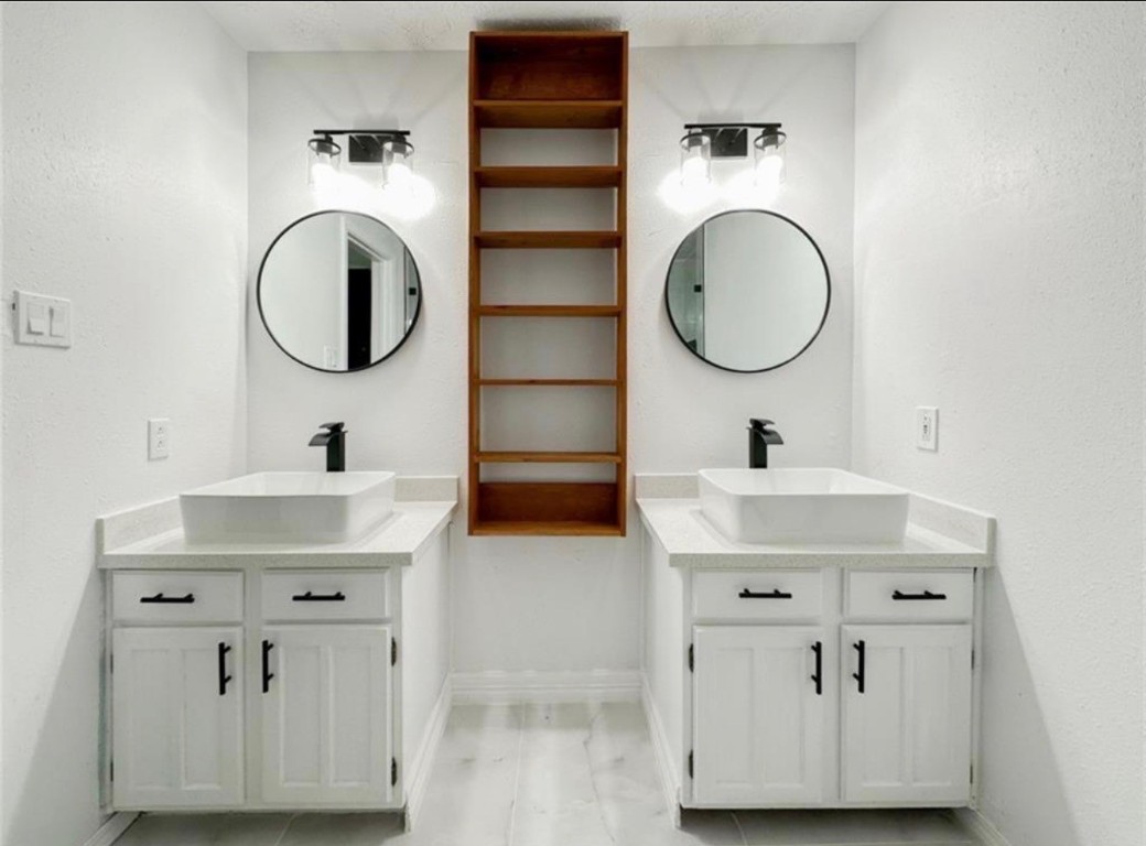 7311 Fuchsia Lane Humble, TX 77346 - Photo 34 of 38 a bathroom with a sink and a mirror