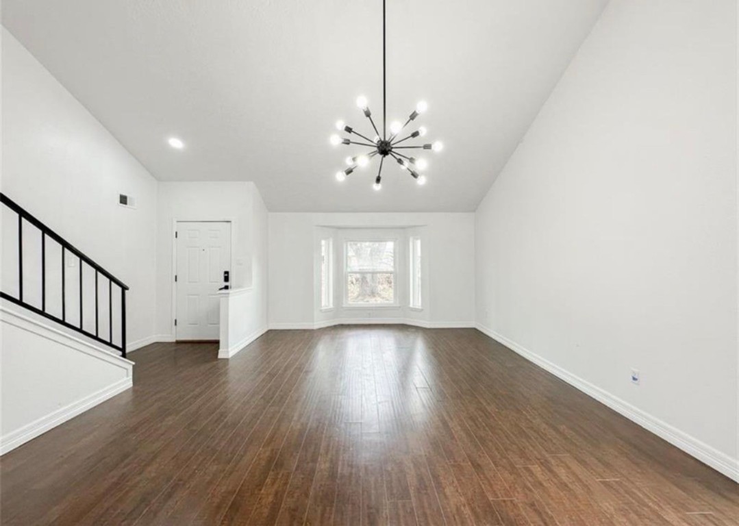 7311 Fuchsia Lane Humble, TX 77346 - Photo 7 of 38 wooden floor in an empty room with a window