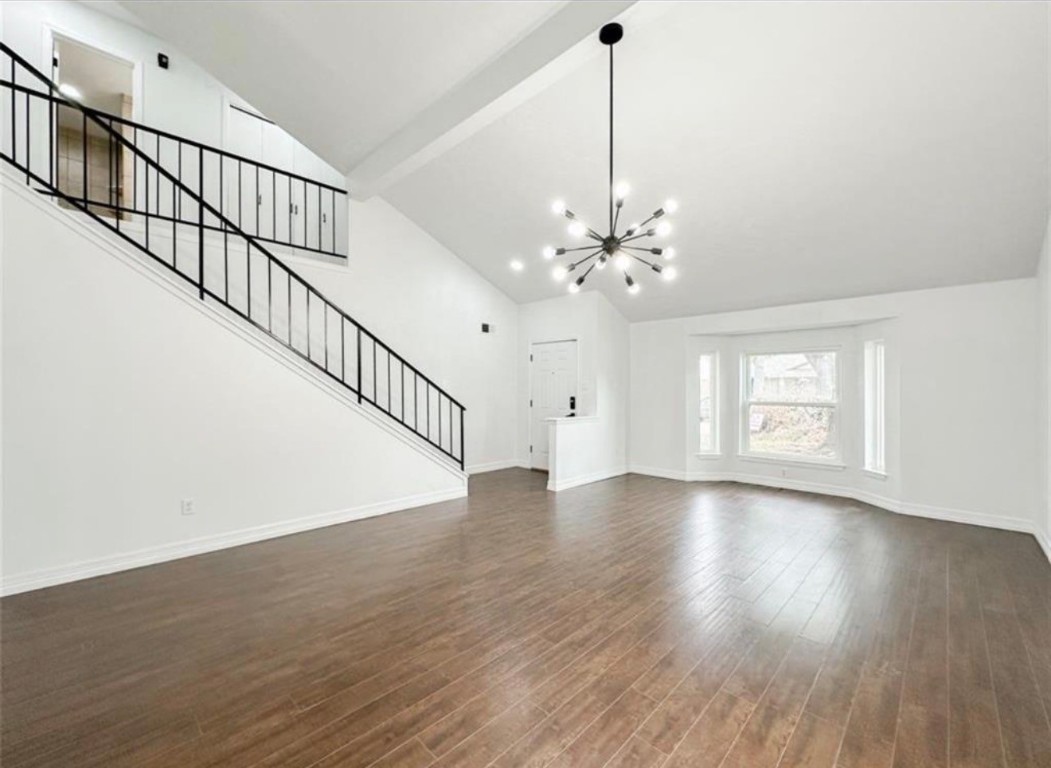 7311 Fuchsia Lane Humble, TX 77346 - Photo 8 of 38 a view of an empty room with wooden floor and a window