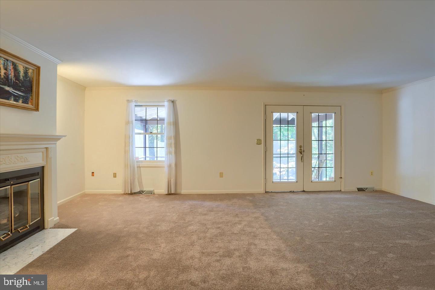 1300 Sand Hill Road Hummelstown, PA 17036 - Photo 8 of 24 a view of an empty room with a fireplace and a window