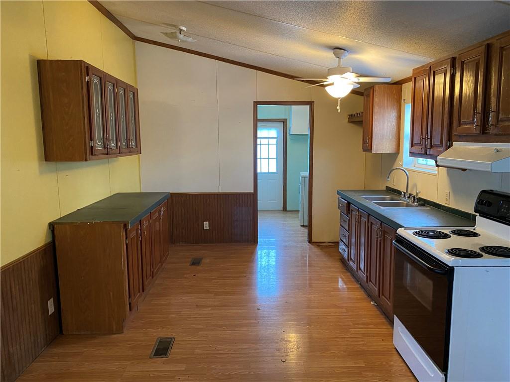 82 Old Brick Road West Alexander, PA 15376 - Photo 5 of 17 a kitchen with stainless steel appliances granite countertop a stove a sink and a refrigerator