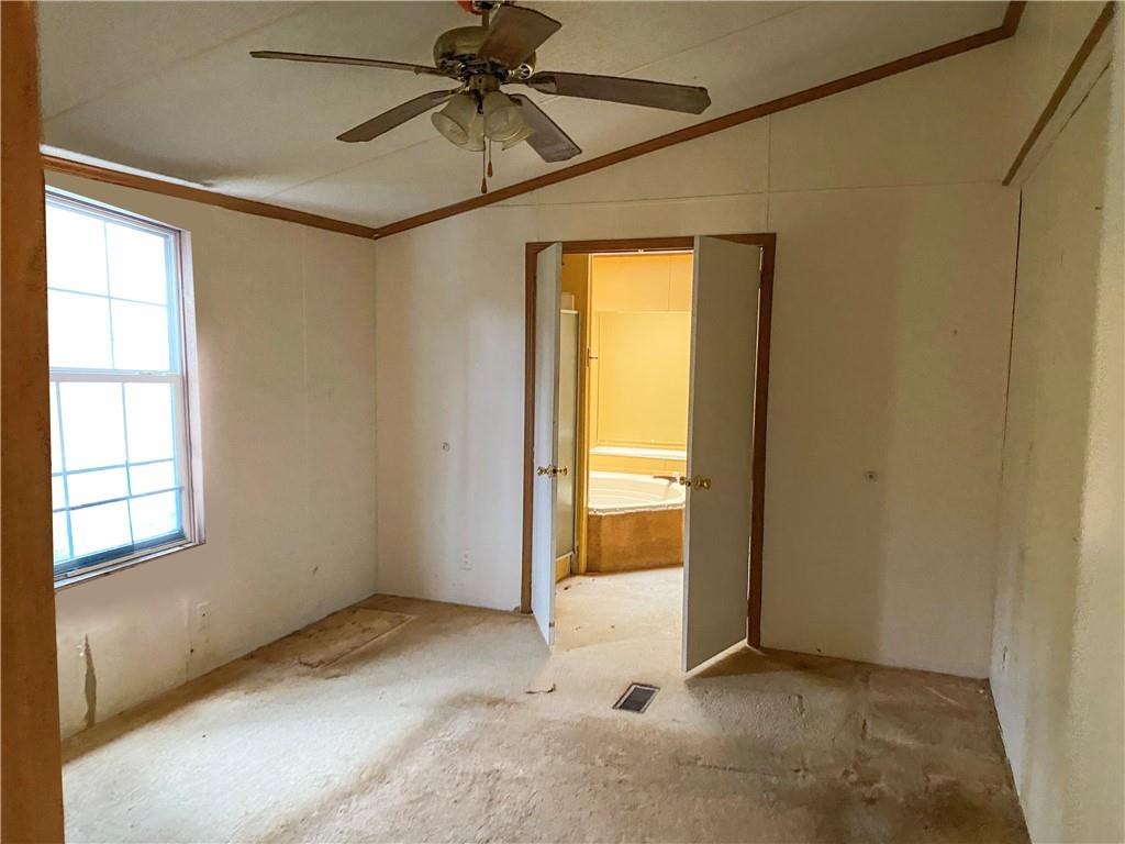 82 Old Brick Road West Alexander, PA 15376 - Photo 8 of 17 an empty room with windows and chandelier fan