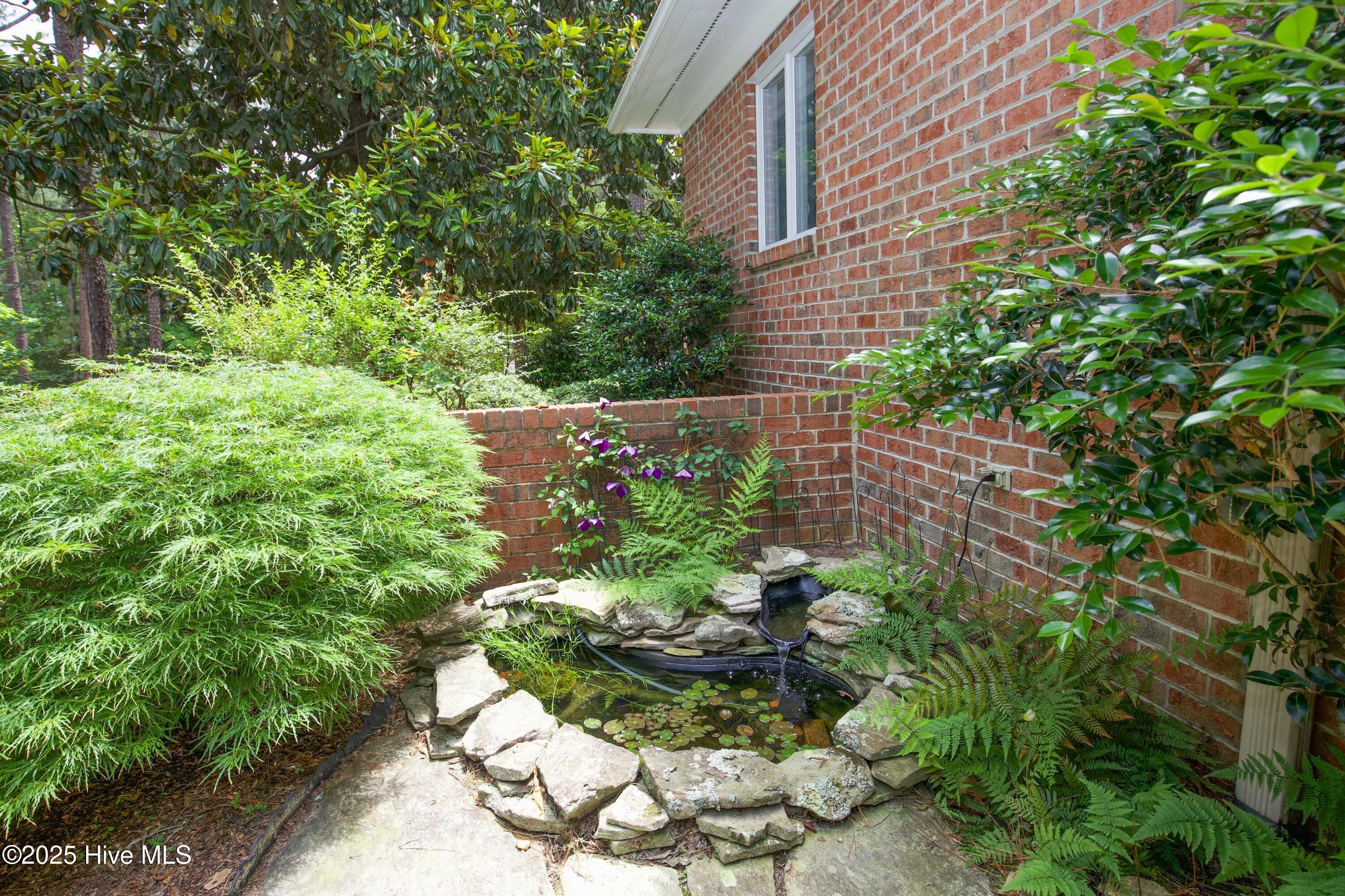 17 Troon Drive Pinehurst, NC 28374 - Photo 11 of 105 Courtyard area koi pond