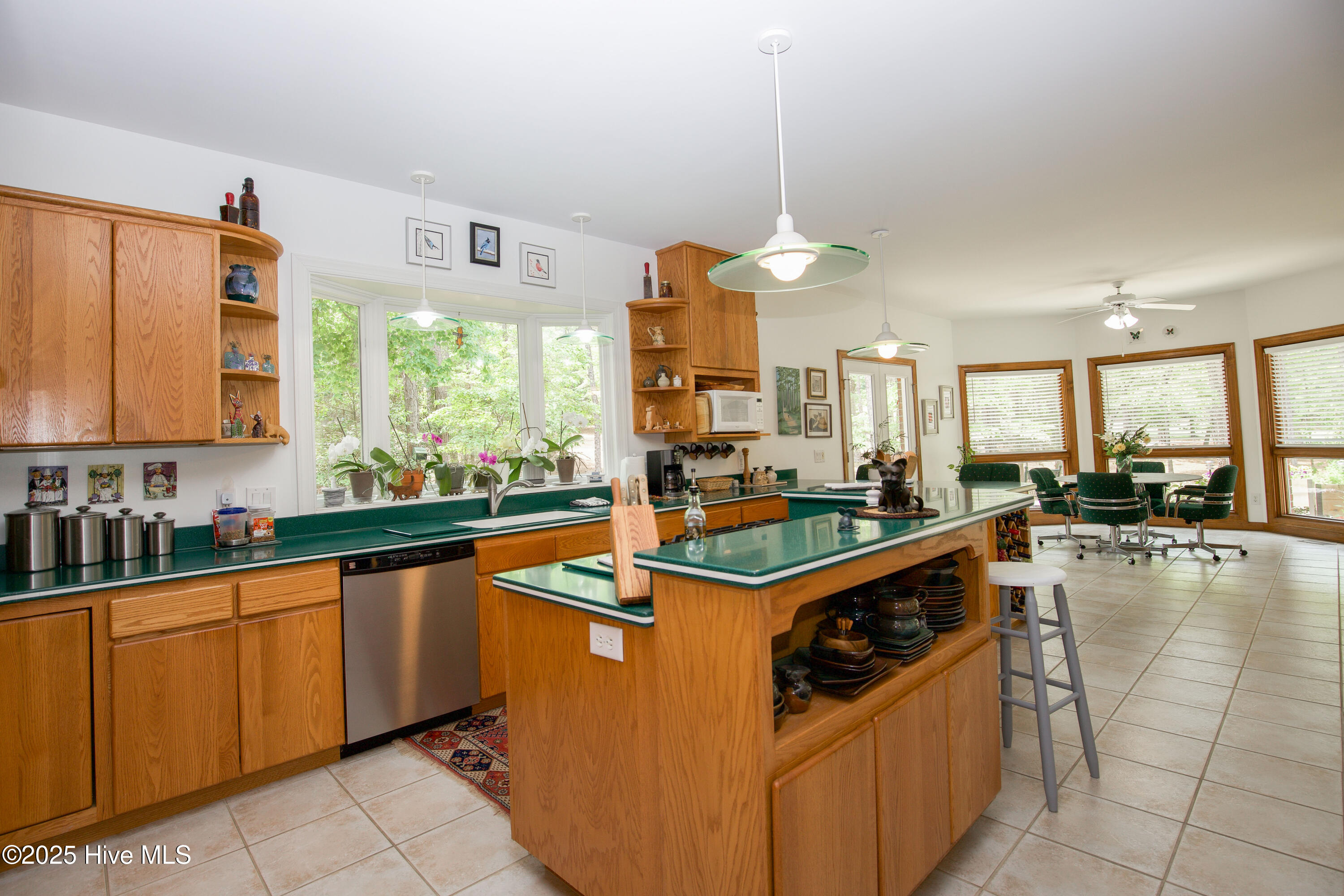 17 Troon Drive Pinehurst, NC 28374 - Photo 43 of 105 Counter storage with seating area & gas cooktop