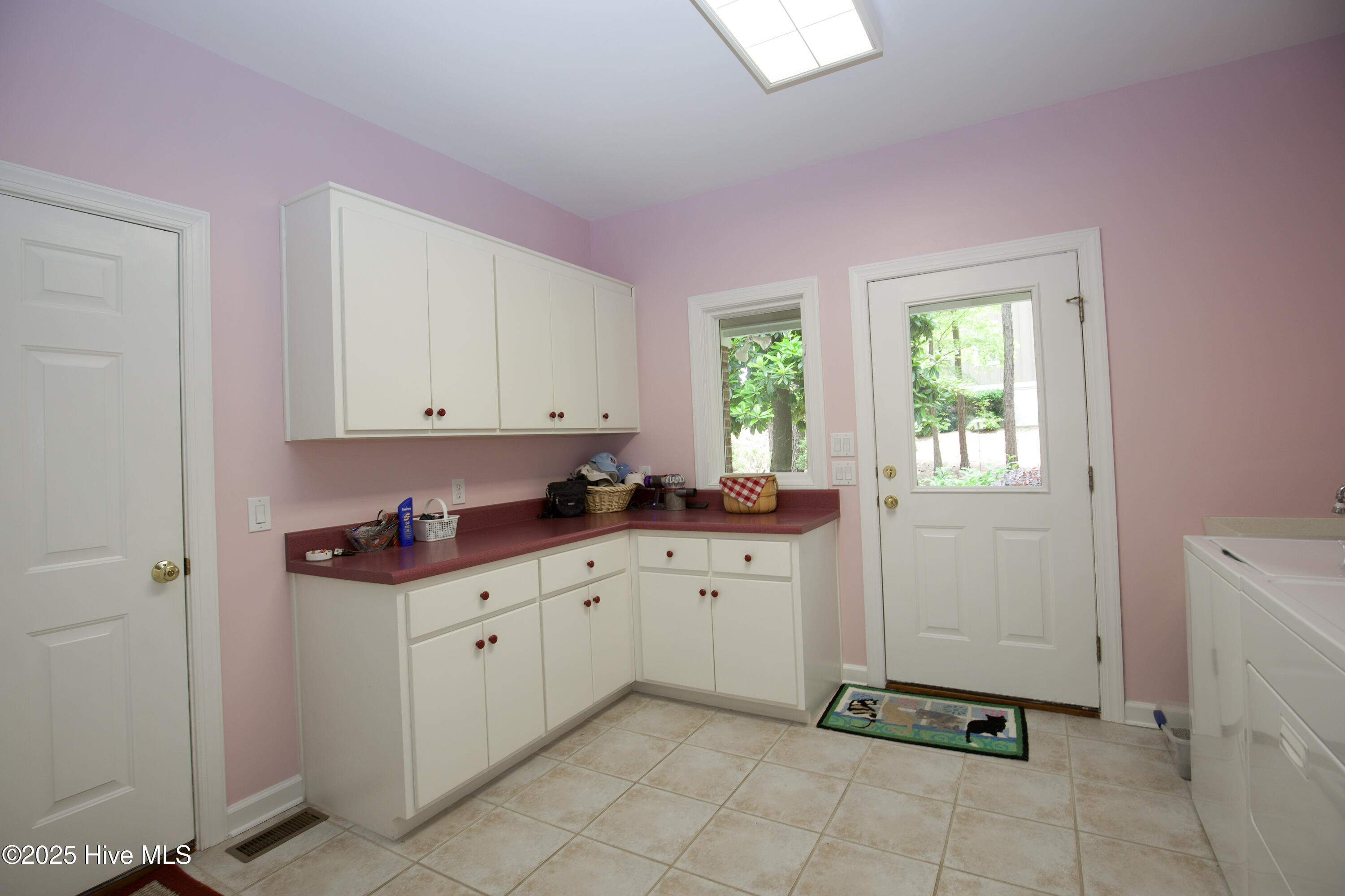 17 Troon Drive Pinehurst, NC 28374 - Photo 45 of 105 Laundry Room Storage/ Back door to side yard