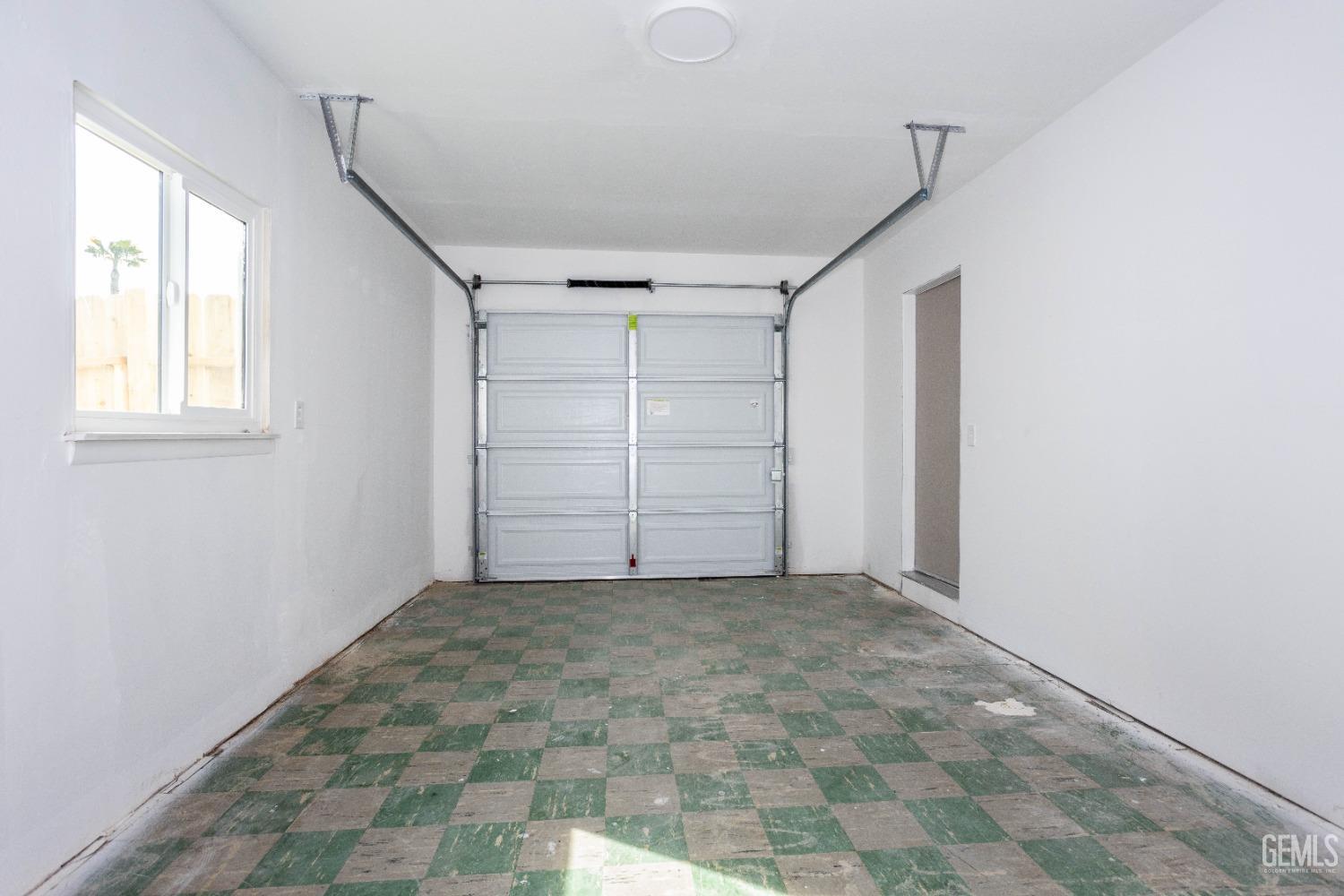 Undisclosed Address Shafter, CA 93263 - Photo 18 of 18 a view of an empty room with a window