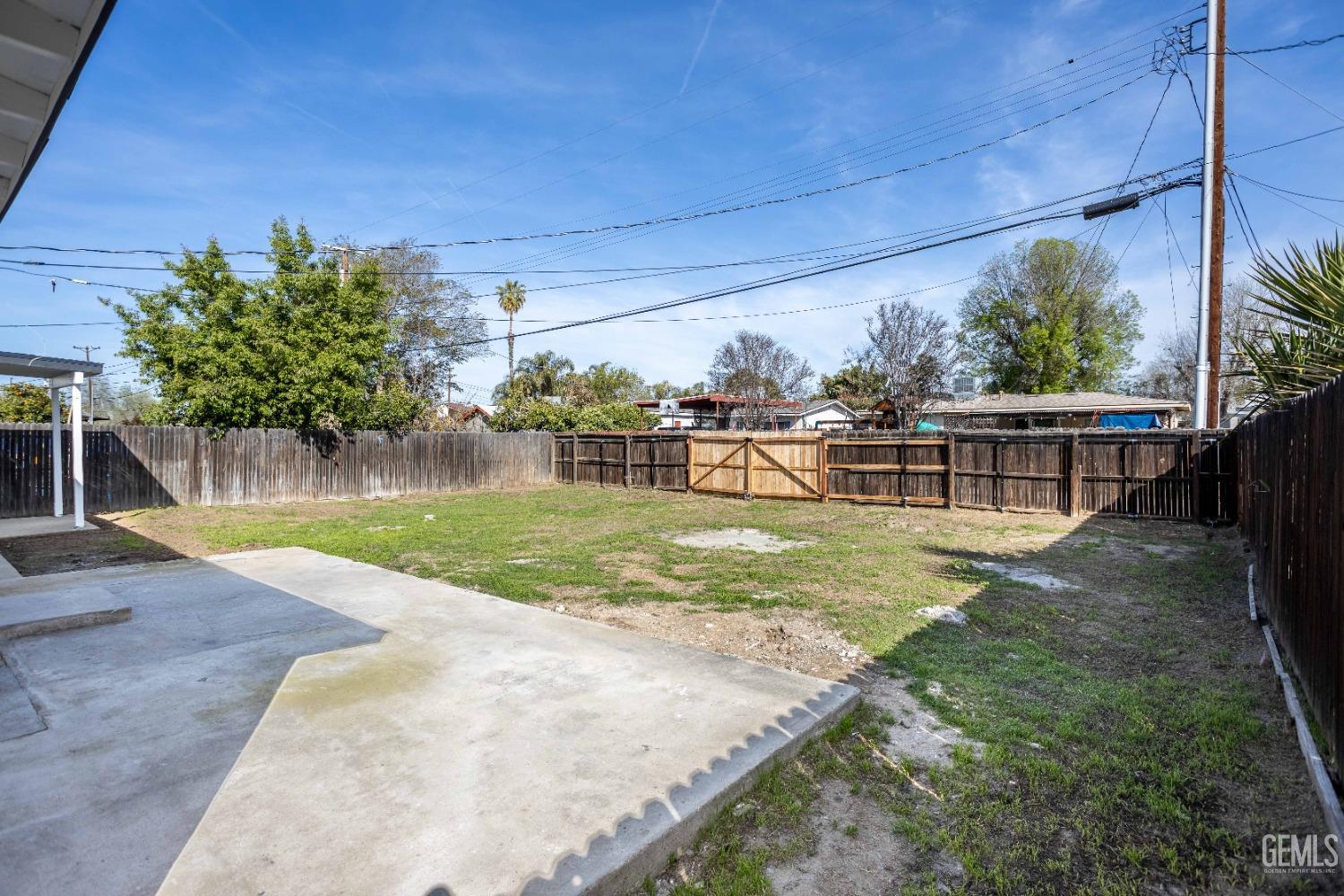 Undisclosed Address Shafter, CA 93263 - Photo 4 of 18 a view of a backyard with a garden