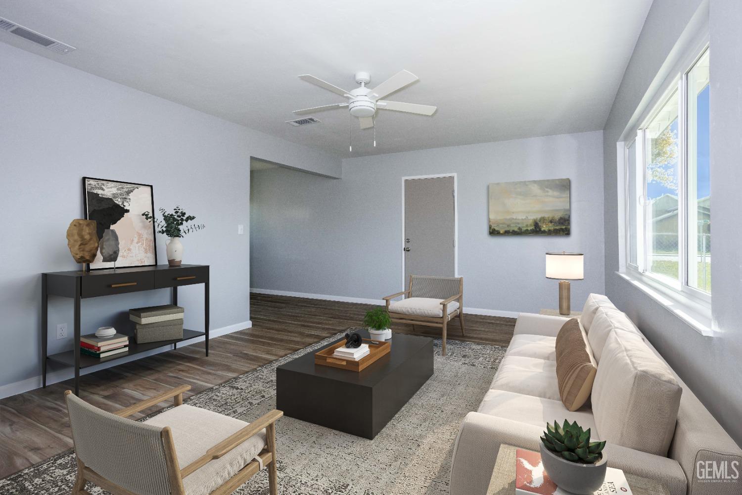 Undisclosed Address Shafter, CA 93263 - Photo 7 of 18 a living room with furniture and a wooden floor