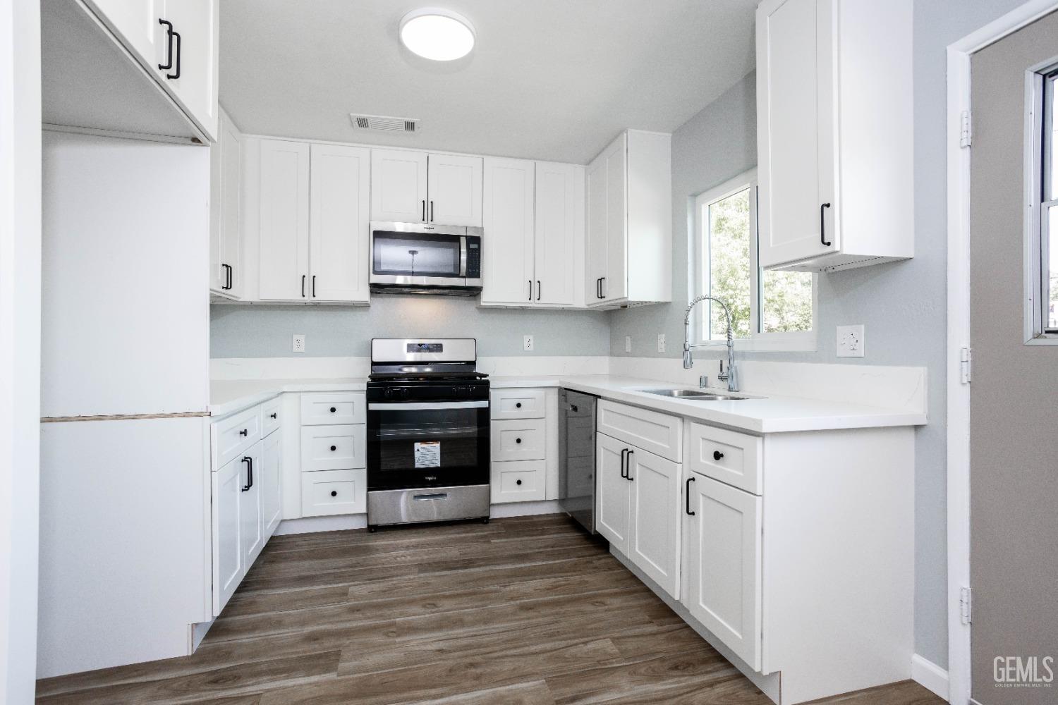 Undisclosed Address Shafter, CA 93263 - Photo 10 of 18 a kitchen with cabinets stainless steel appliances and a window
