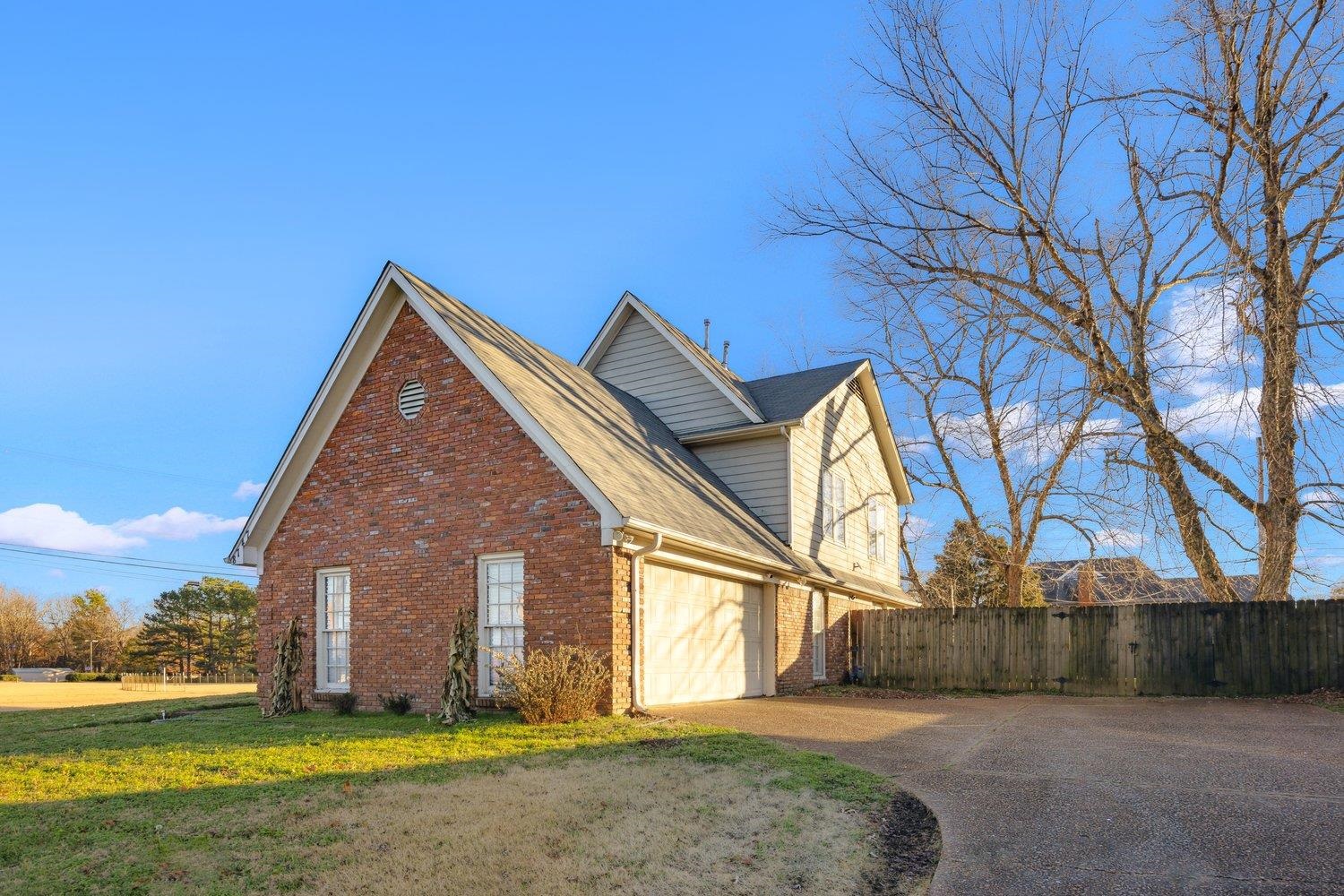 8747 Walnut Grove Road Memphis, TN 38018 - Photo 18 of 20 a view of a house with a yard