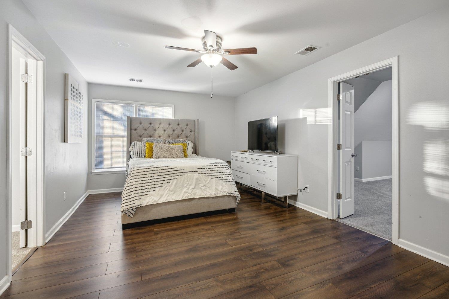 8747 Walnut Grove Road Memphis, TN 38018 - Photo 20 of 20 a bedroom with a bed and a view mirror