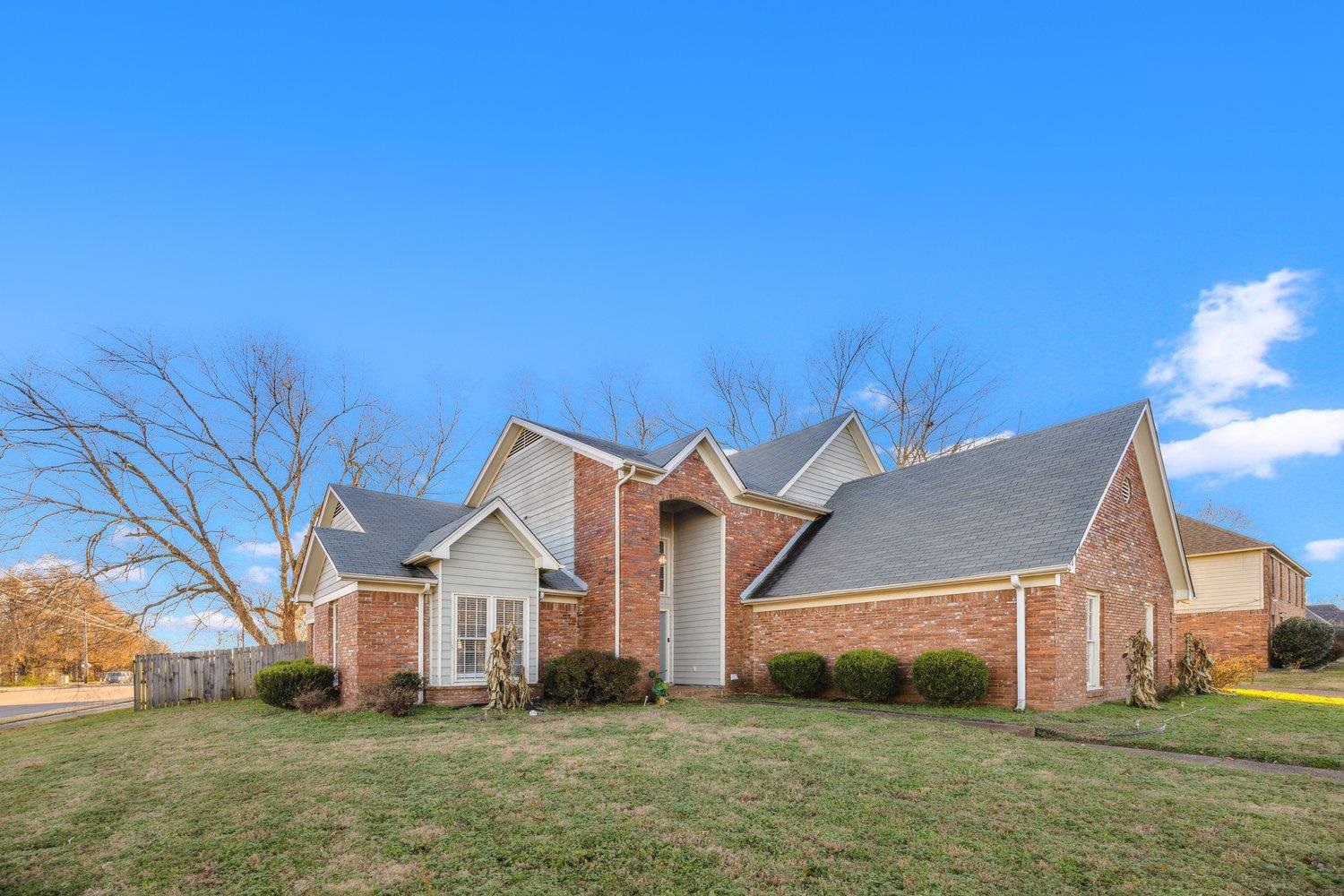 8747 Walnut Grove Road Memphis, TN 38018 - Photo 2 of 20 front view of a house with a yard