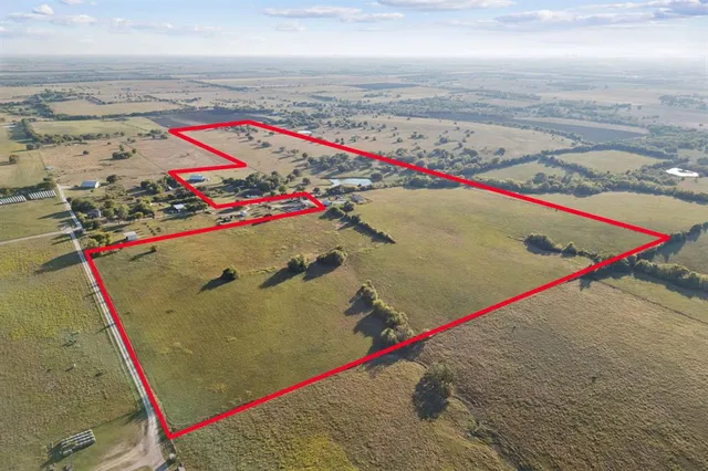 an aerial view of beach and ocean