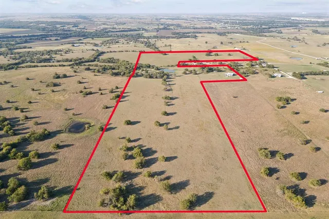 an aerial view of beach and ocean