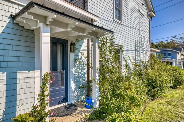 a view of a house with a flower garden