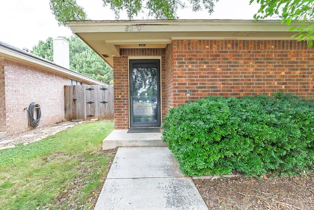 a view of a room with wooden floor and small space